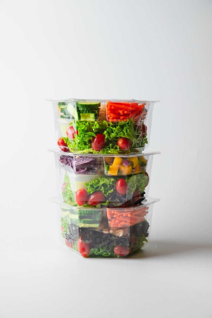 Freshly sealed Inspired Go salad showing crisp ingredients